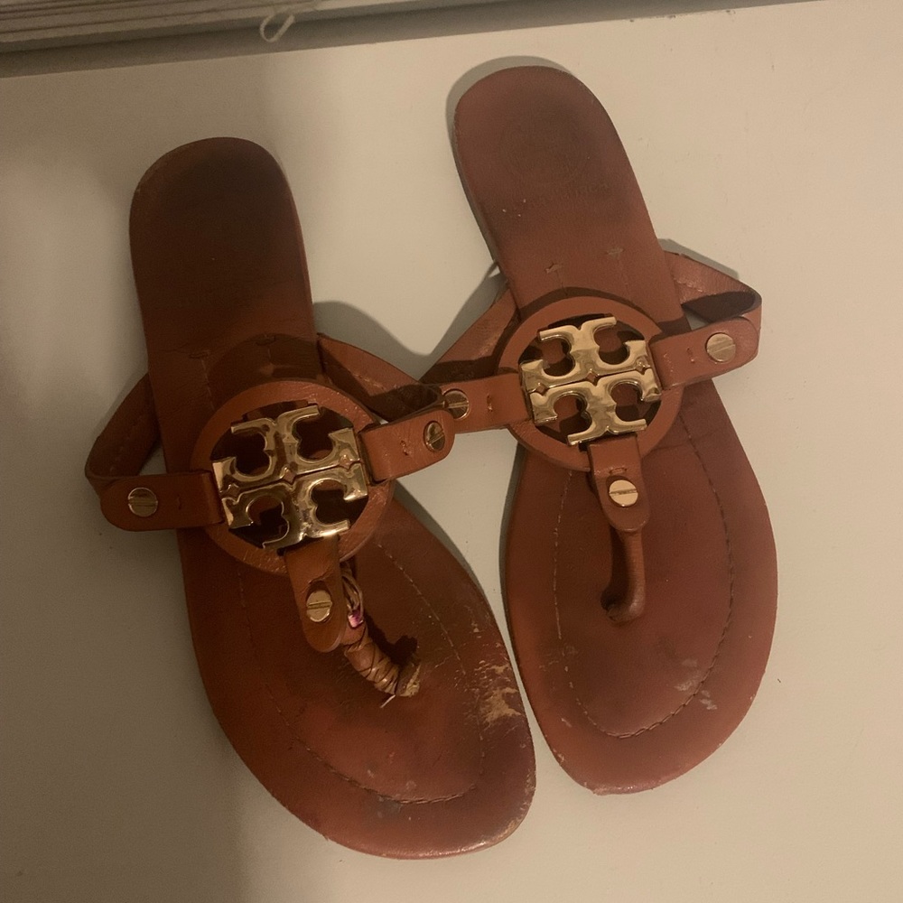Tan Tory Burch Sandals with gold accents.
